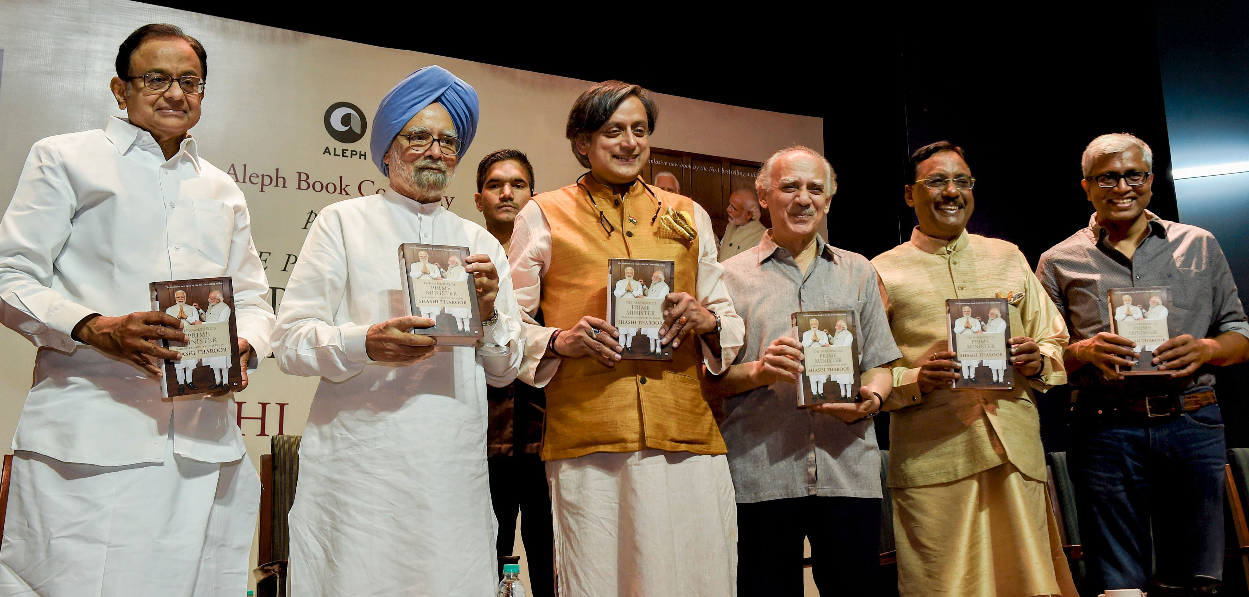 Former prime minister Manmohan Singh, Congress leader P Chidambaram, former Union minister Arun Shourie, former diplomat Pavan Verma and former jounalist Ashutosh at the release the book "Paradoxical Prime Minister" authored by Shashi Throor (3rd from left) in New Delhi, Friday. PTI 