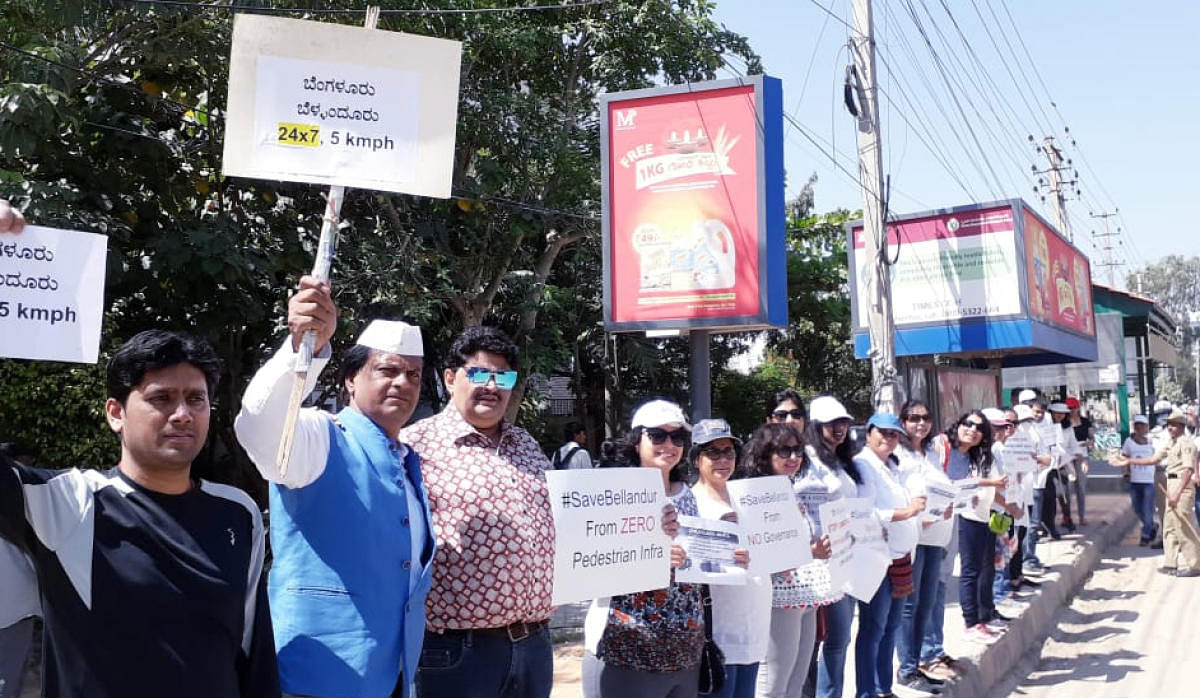 The residents of Bellandur formed human chain demanding better infrastructure facilities from BBMP on Saturday.