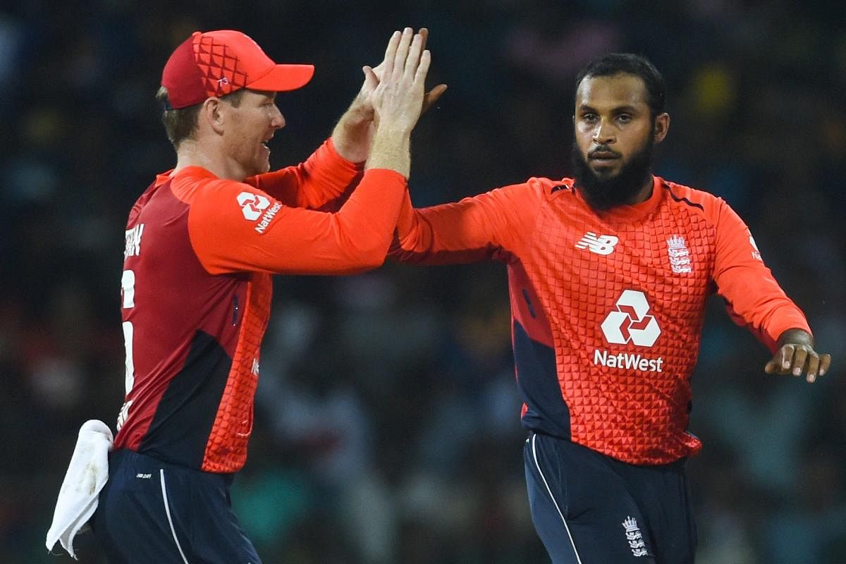 SPINNING A WEB: England's Adil Rashid (right) celebrates with Eoin Morgan after dismissing Sri Lanka's Kamindu Mendis. AFP
