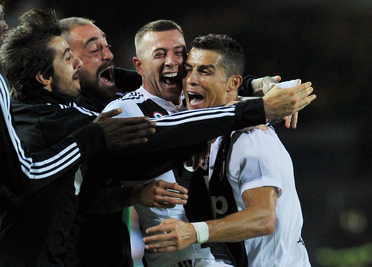 EVER DEPENDABLE: Juventus' Cristiano Ronaldo (right) celebrates with team-mates after scoring the second goal. Reuters 