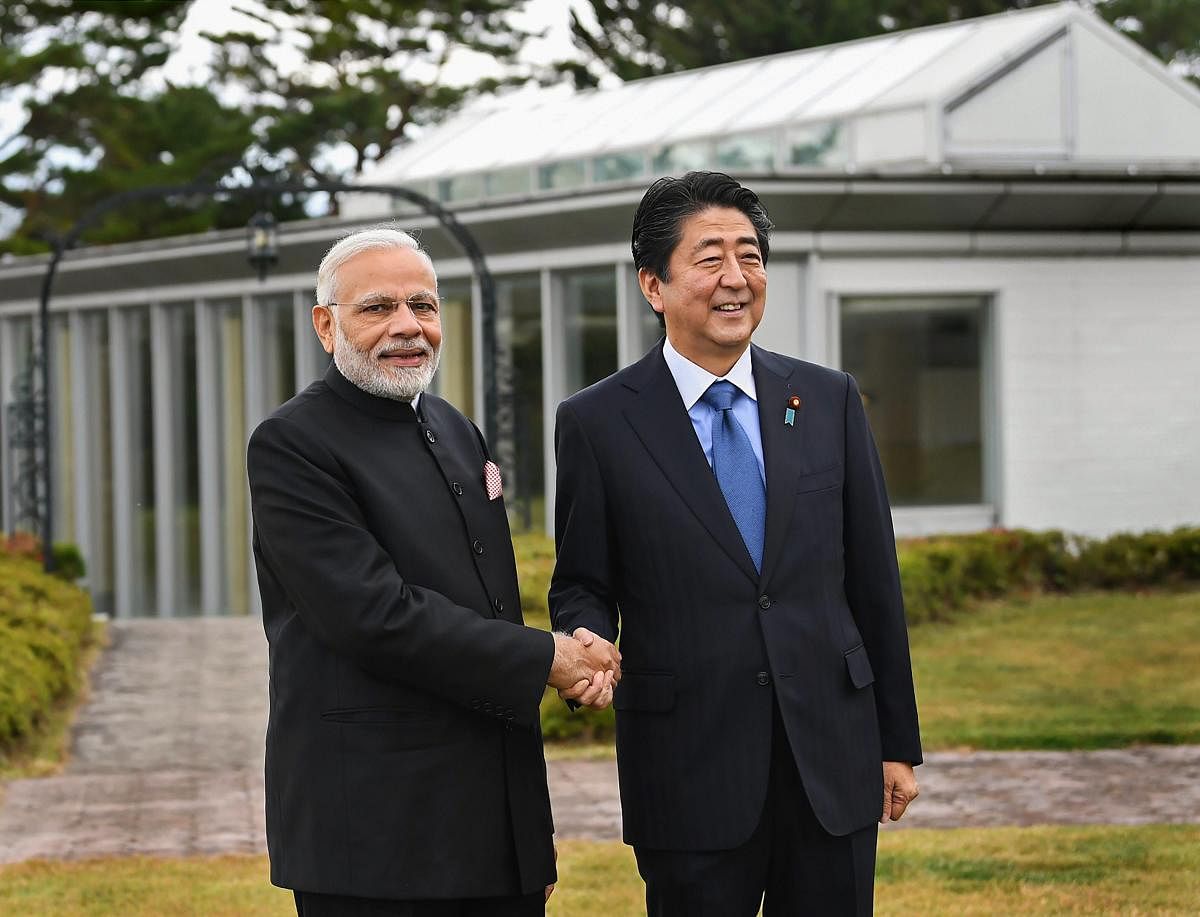 Prime Minister Narendra Modi shakes hands with his Japanese counterpart Shinzo Abe, at Yamanashi, Japan, Sunday, Oct 28, 2018. (PIB Photo via PTI)