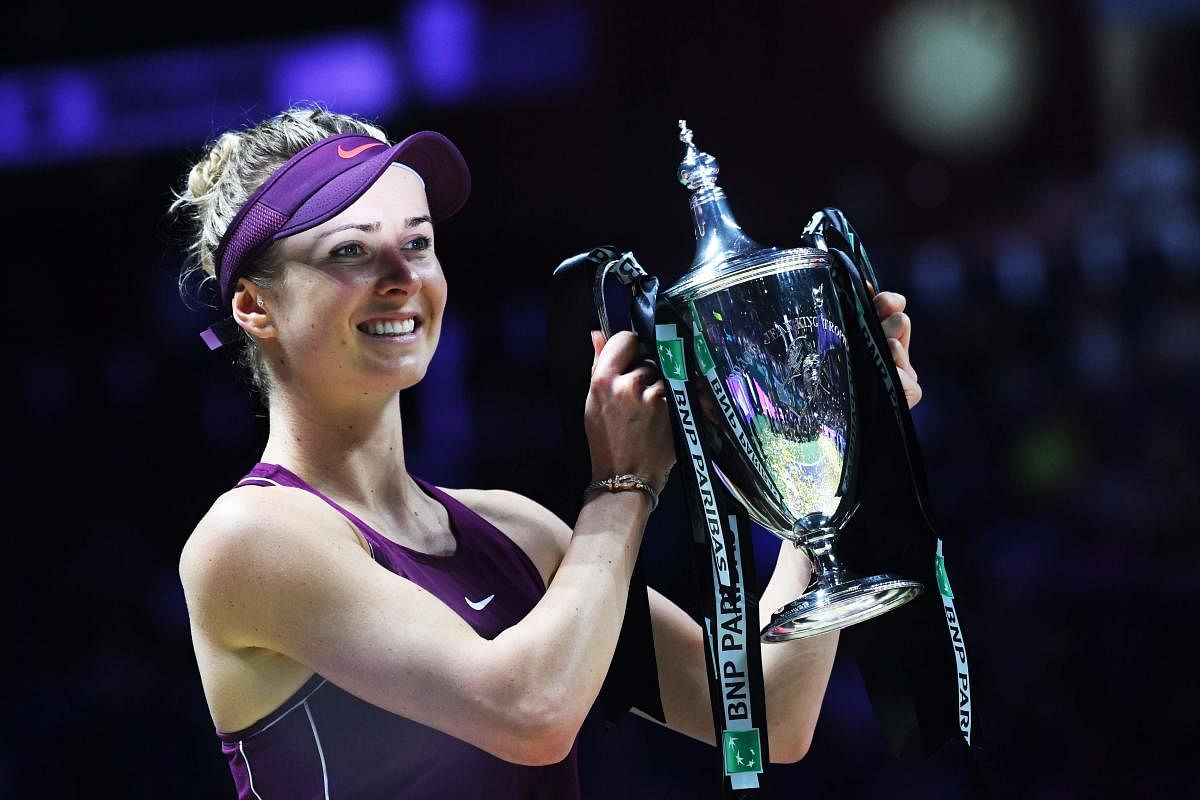 Ukraine's Elina Svitolina with the WTA Finals after defeating Sloane Stephens in the final on Sunday. AFP