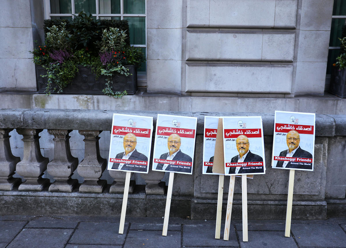 Placards can be seen outside the Saudi Arabian Embassy in London as people protest against the killing of journalist Jamal Khashoggi in Turkey. (Reuters Photo)