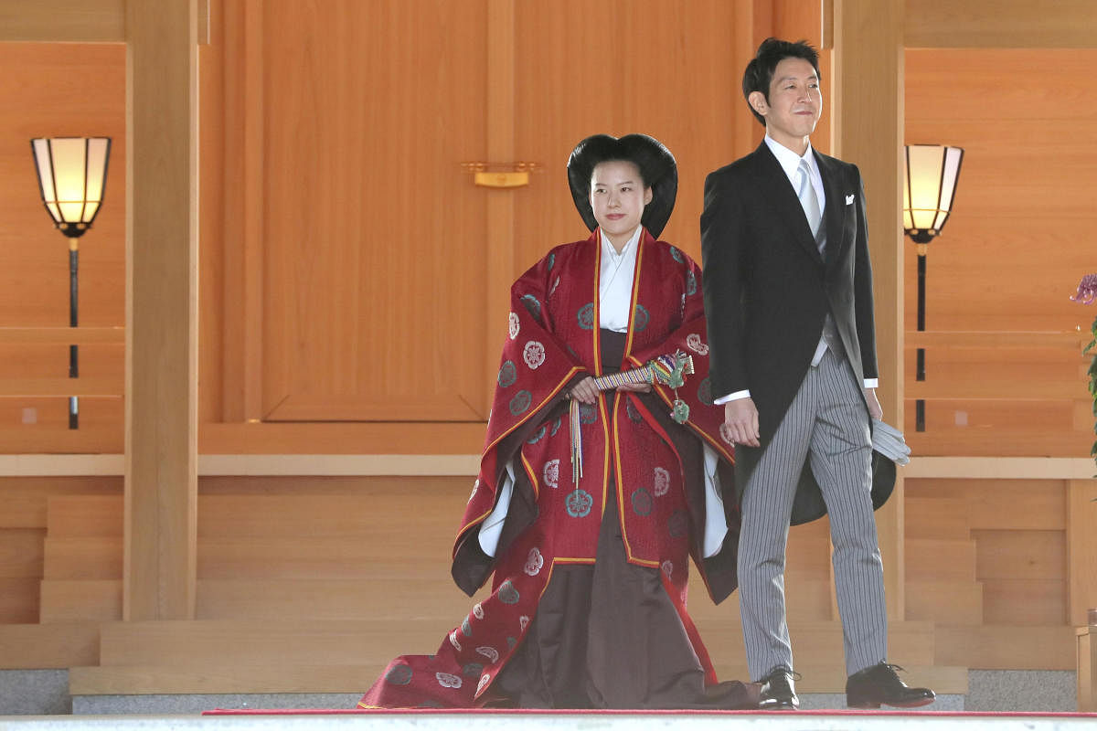 Japanese Princess Ayako (L) and her husband Kei Moriya are pictured after their wedding ceremony at the Meiji Shrine in Tokyo, Japan, in this photo released by Kyodo on October 29, 2018. (Kyodo/via REUTERS)