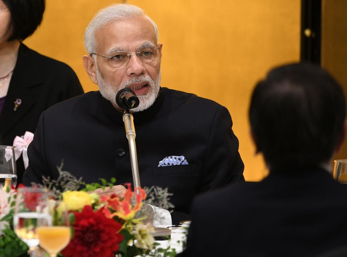 Indian Prime Minister Narendra Modi delivers a speech while attending a luncheon hosted by the Keidanren at a Tokyo hotel on October 29, 2018. (Photo by Toshifumi KITAMURA / AFP)