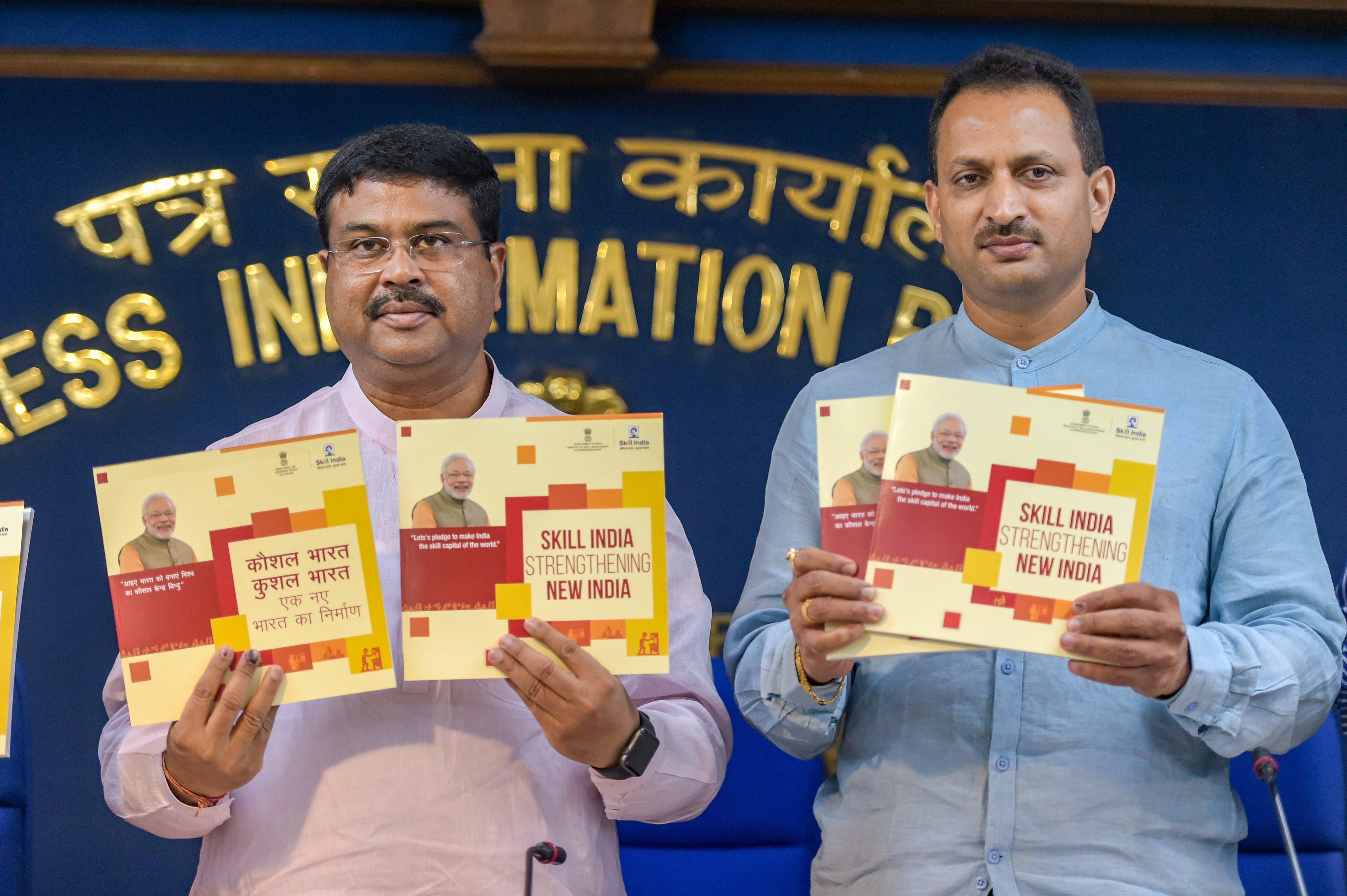 Union Minister for Petroleum, Natural Gas and Skill Development, Dharmendra Pradhan with MoS Anant Kumar Hegde (R) release booklets during a press conference on 48 months achievements and initiatives of his ministry under the NDA government rule, in New Delhi on Wednesday. PTI