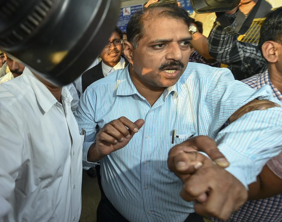 Deputy Superintendent of Police Devender Kumar after being produced at Patiala House Courts, in New Delhi, Tuesday, Oct 23, 2018. CBI arrested Devendra Kumar Monday in connection with bribery allegations involving its Special Director Rakesh Asthana. (PTI