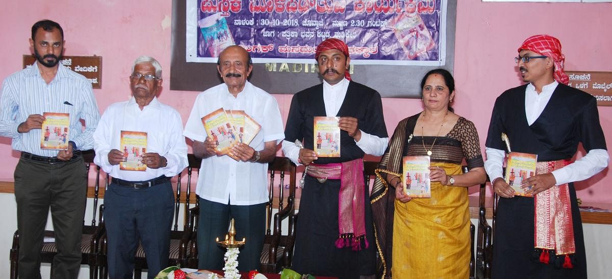 Congress leader M C Nanaiah releases the book ‘Kodagu Principality Vs British Empire’ written by Mookonda Nithin Kushalappa in Madikeri on Tuesday.