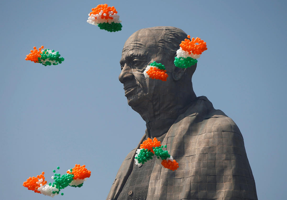Tri-coloured balloons fly around the "Statue of Unity" portraying Sardar Vallabhbhai Patel, one of the founding fathers of India, during its inauguration in Kevadia, in the western state of Gujarat, India, October 31, 2018. REUTERS
