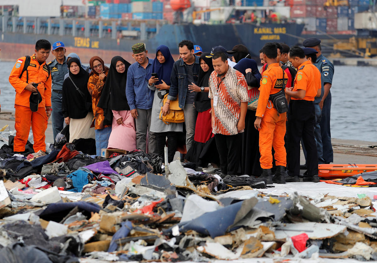Families of passengers of Lion Air flight JT610 stand as they look at the belongings of the passengers at Tanjung Priok port in Jakarta, Indonesia, October 31, 2018. REUTERS