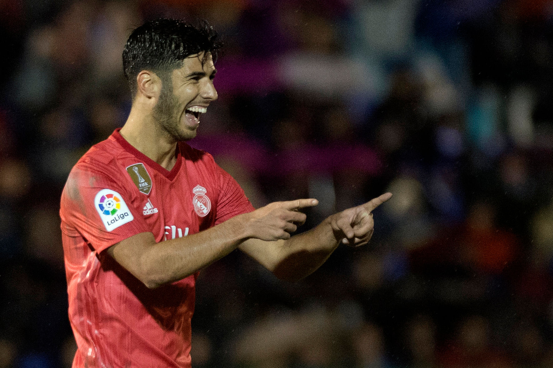 Real Madrid's Marco Asensio celebrates after scoring against Melilla during their Cop del Rey game on Wednesday. AFP