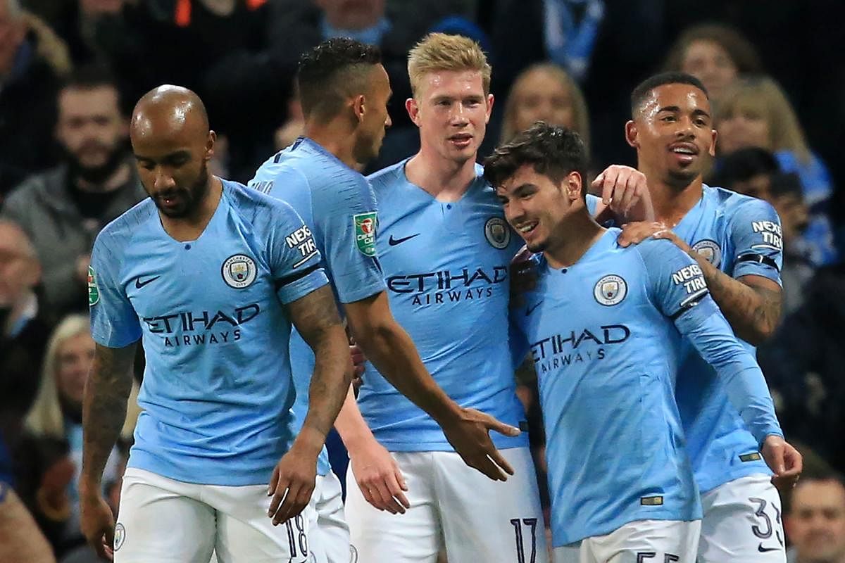 TEEN ON TARGET: Manchester City's Brahim Diaz (second from right) is congratulated by his teammates after scoring against Fulham on Thursday. AFP