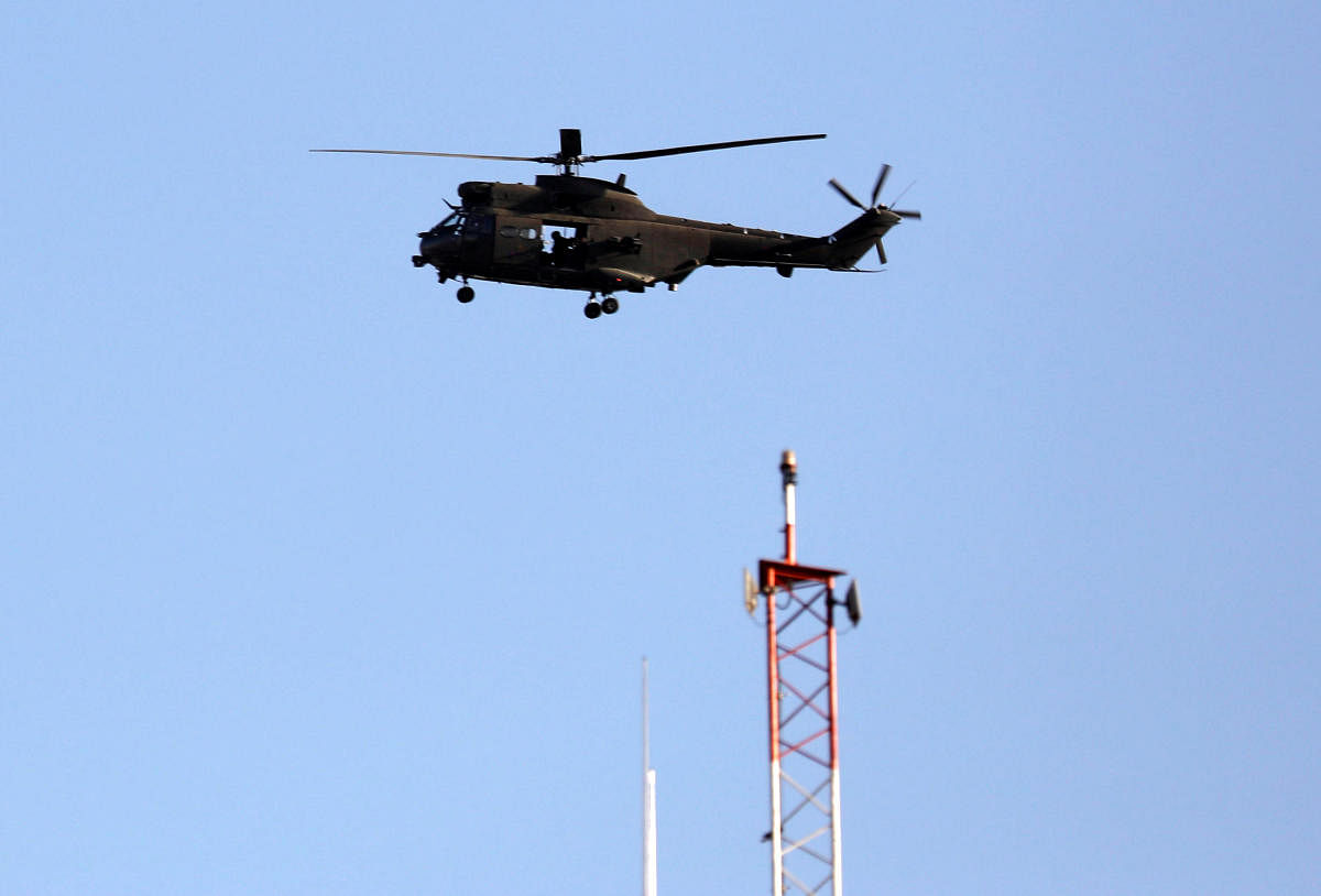 A NATO helicopter flies over the Resolute Support headquarters in Kabul, Afghanistan. Reuters Photo