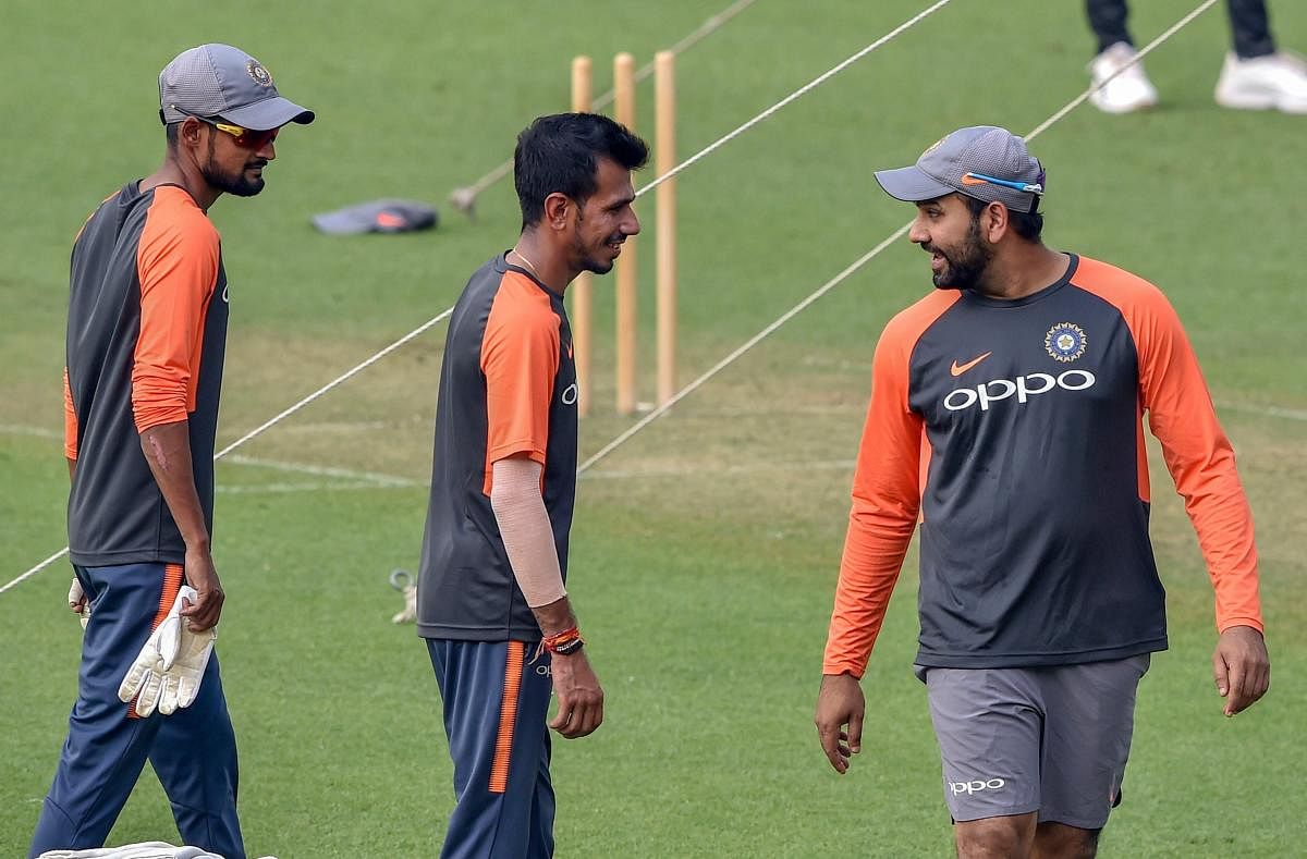 Rohit Sharma (right) with Yuzvendra Chahal at a training session ahead of the 1st T20 match against West Indies at the Eden Gardens in Kolkata. PTI