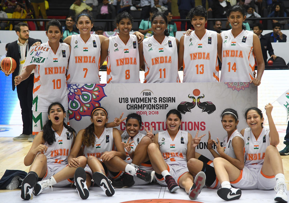 Indian players celebrate after emerging winners in Division B of the FIBA U-18 Women Asian basketball championship. STANDING (from left) Ishwarya Janardhan, Harshitha Bopaiah, Pushpa Senthil Kumar, Srikala Rani, Ann Marry Zachariah and Anu Maria. SITTING: