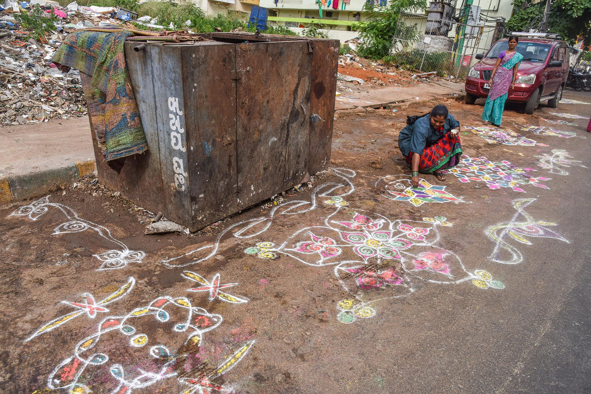 Civic apathy: Sanitation workers had cleared garbage from the black spots and drew rangolis in order to prevent people from littering. DH file photo