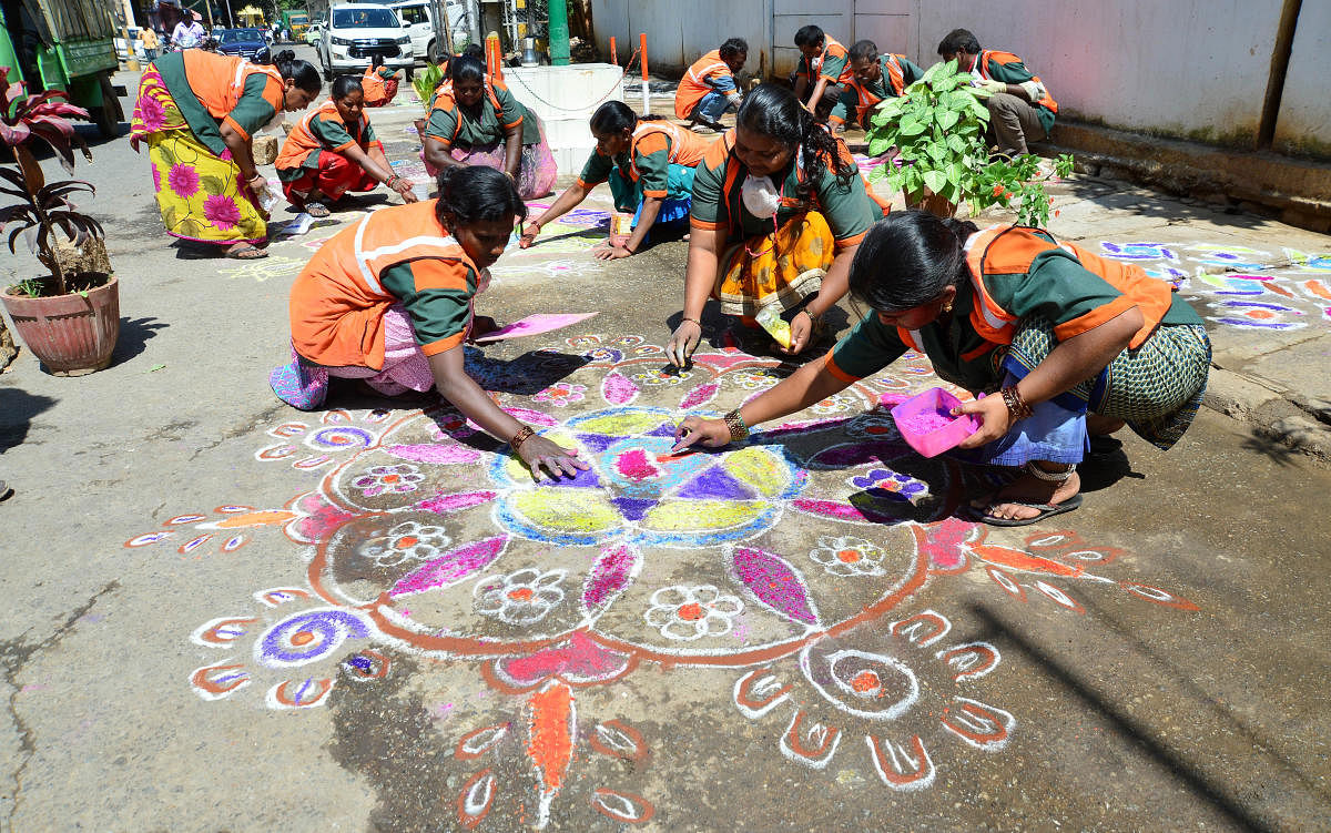 Black spots that were cleared of garbage and beautified by pourakarmikas with rangolis were found to be littered again. DH Photo