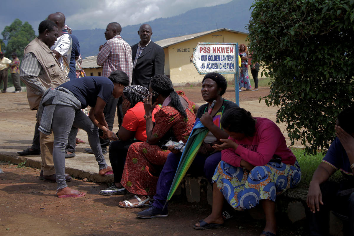 Parents wait for news of their children at a school where 79 pupils were kidnapped in Bamenda, Cameroon November 6, 2018. (Reuters Photo)