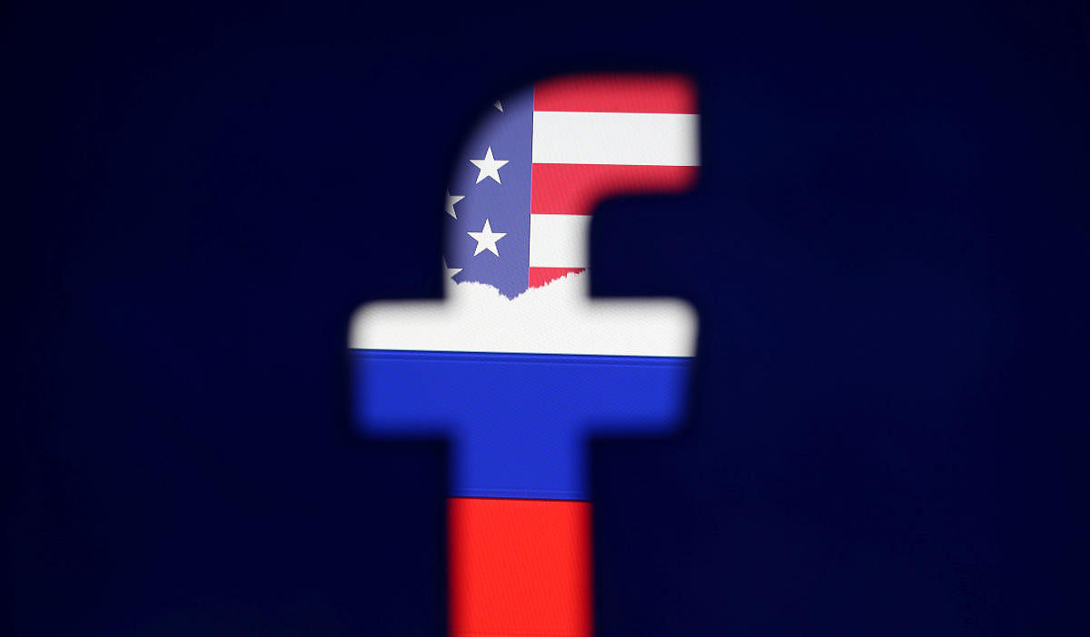 Photo illustration of a 3D printed Facebook logo in front of a displayed Russian flag. Reuters file photo