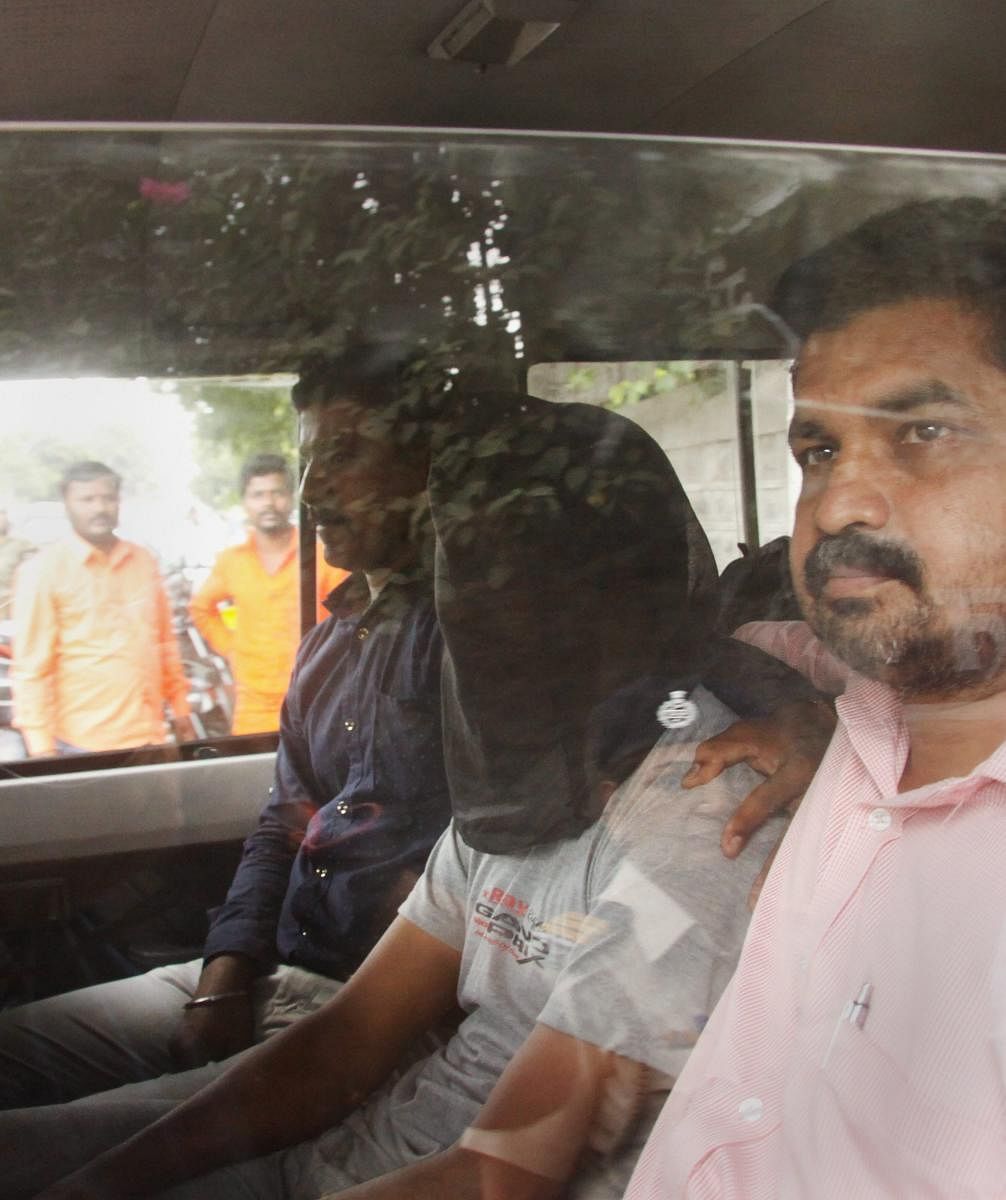 In this undated file photo, Sharad Kalaskar accussed in rationalist Narendra Dabholkar's murder is taken to Pune court. PTI