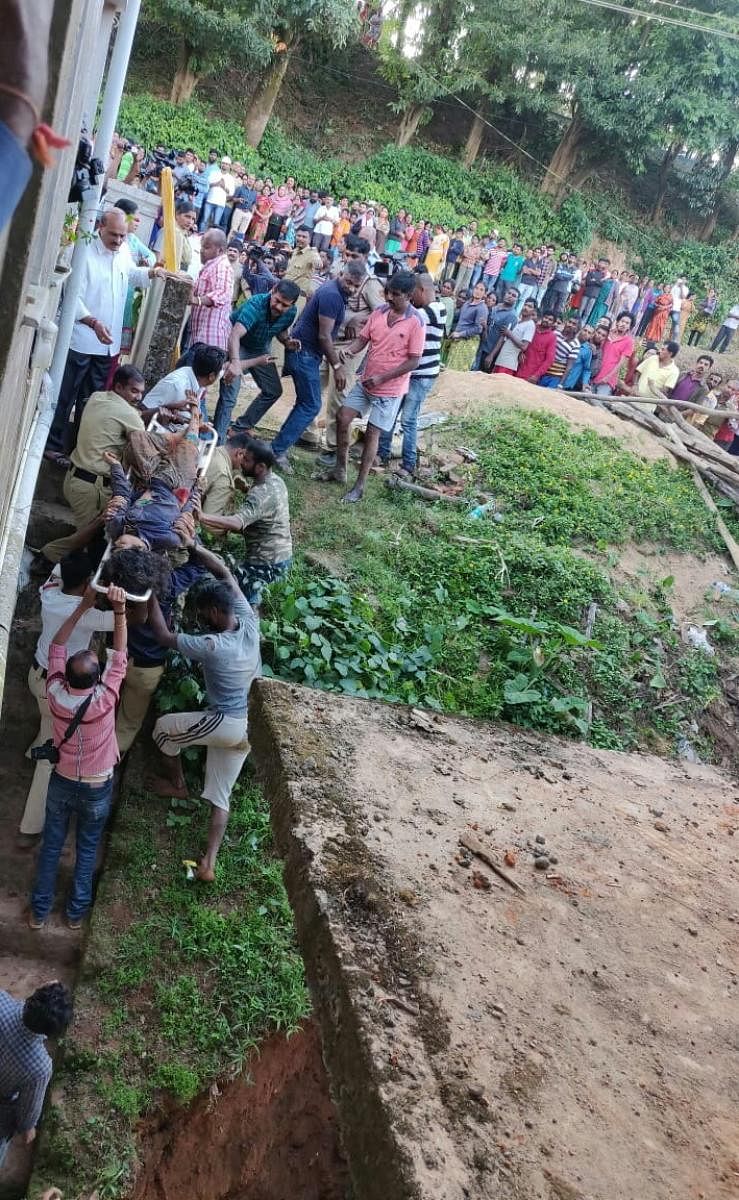 Two labourers were rescued after soil caved-in at a construction site in Madikeri on Tuesday.