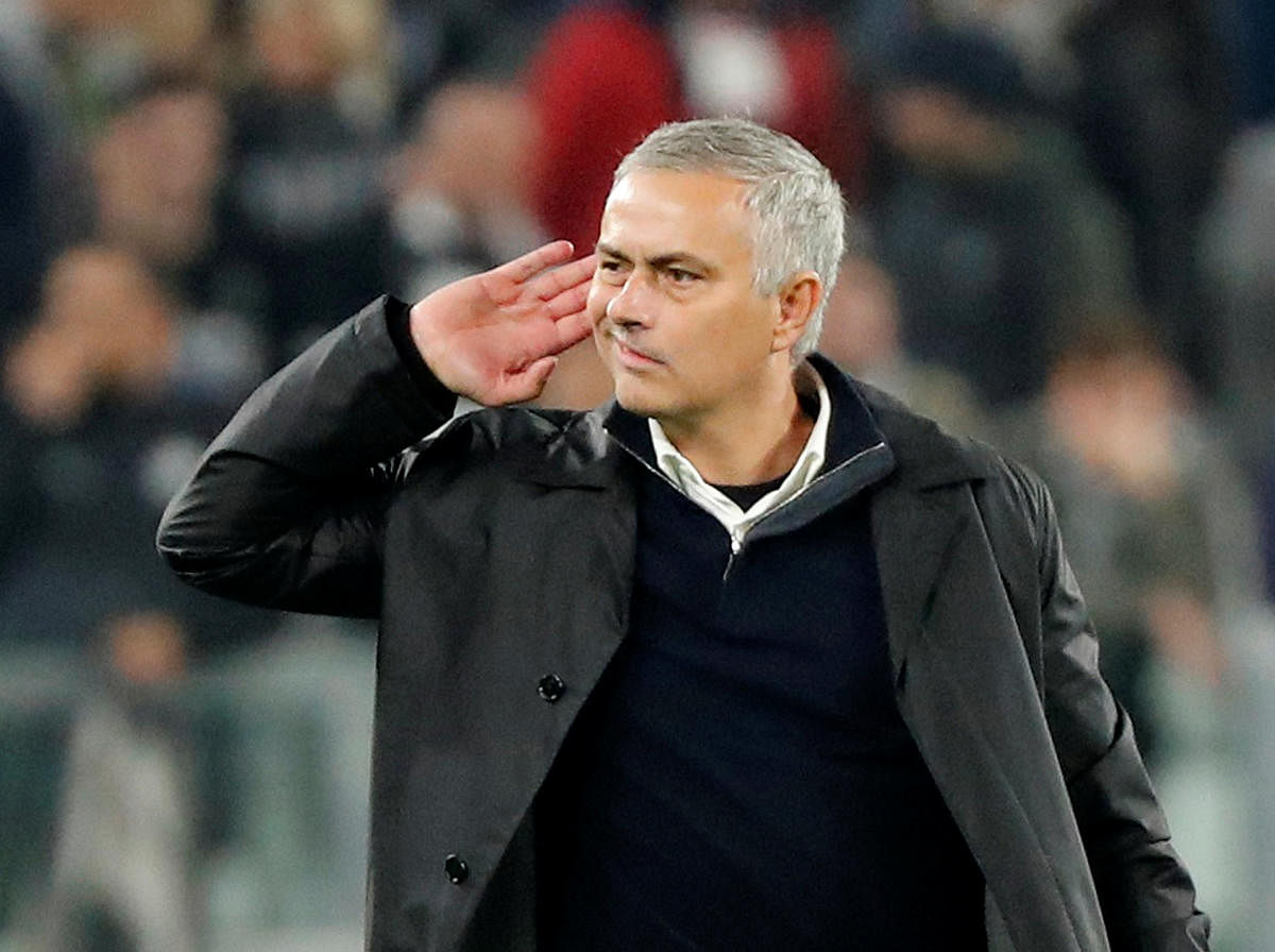 Manchester United manager Jose Mourinho gestures to Juventus fans after the match. REUTERS
