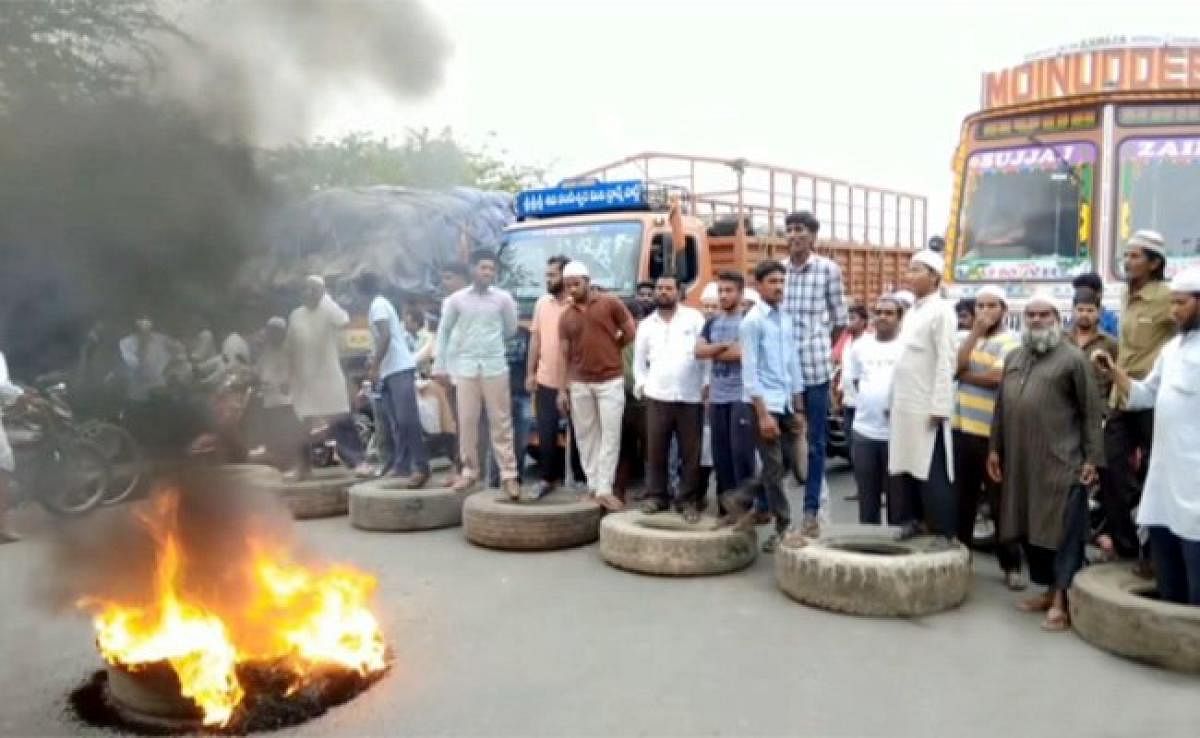 Agitators block the Addanki-Narketpally state highway in protest against the rape of a minor on Wednesday.