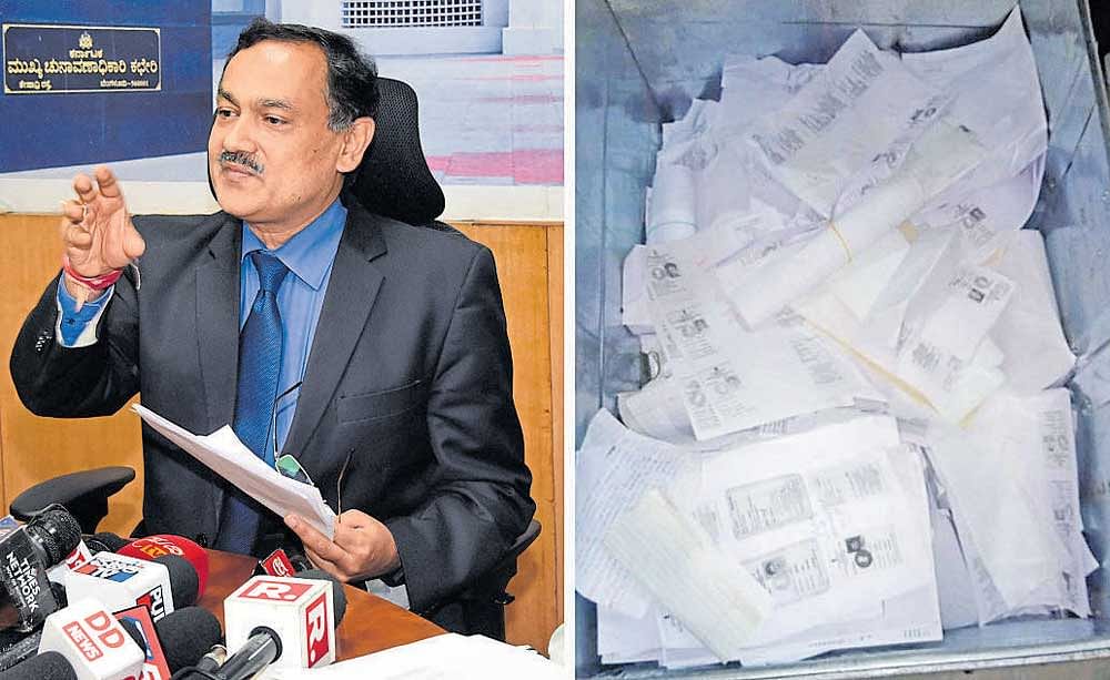 Chief Electoral Officer Sanjiv Kumar addresses an emergency press meet on Tuesday night about the voters’ ID cards found in RR Nagar (right) earlier in the day. DH PHOTOS