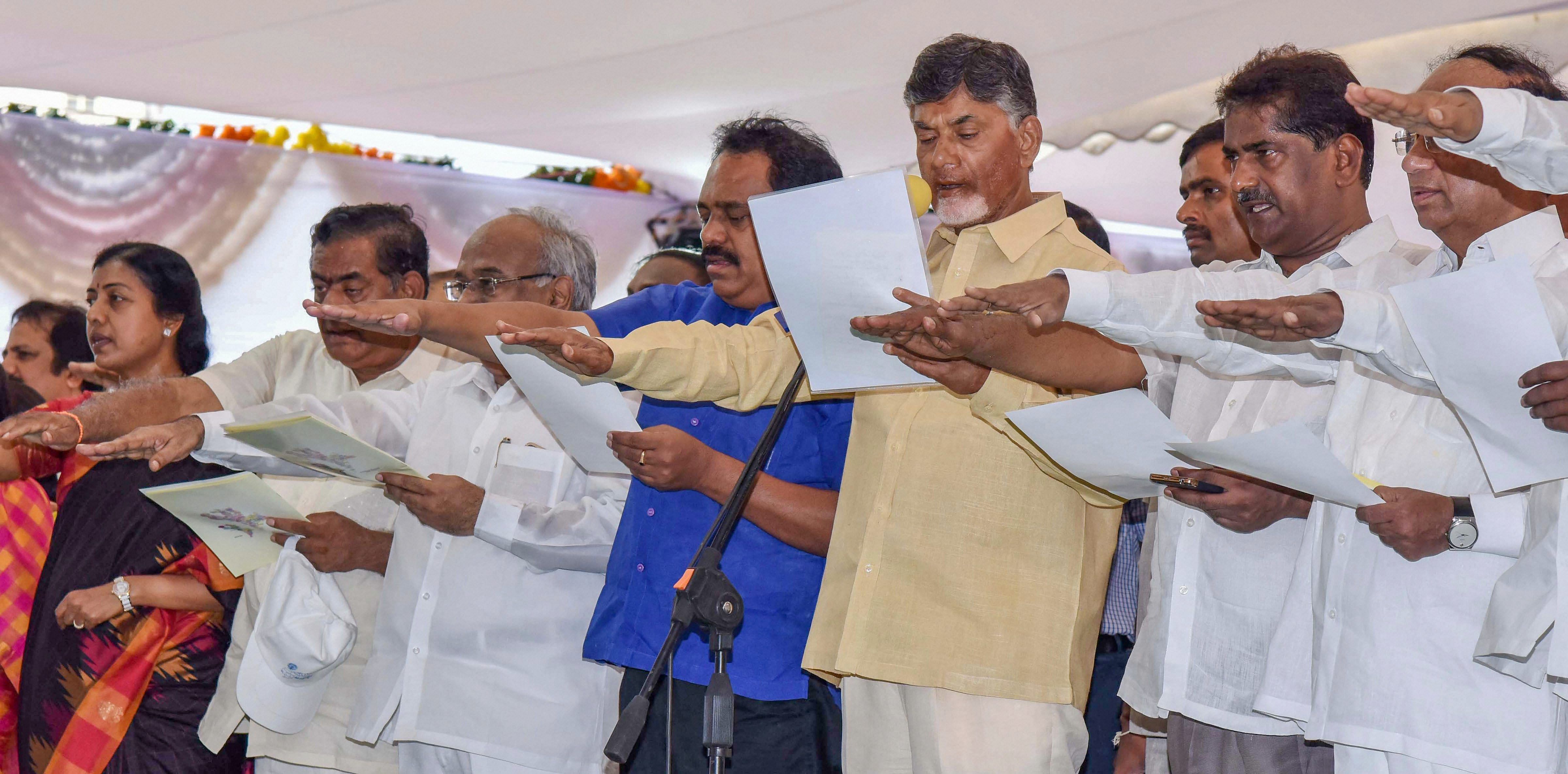 Andhra Pradesh Chief Minister N Chandrababu Naidu administers oath to the people during a ‘Nava Nirmana Deeksha’ programme, in Vijayawada on Saturday. PTI