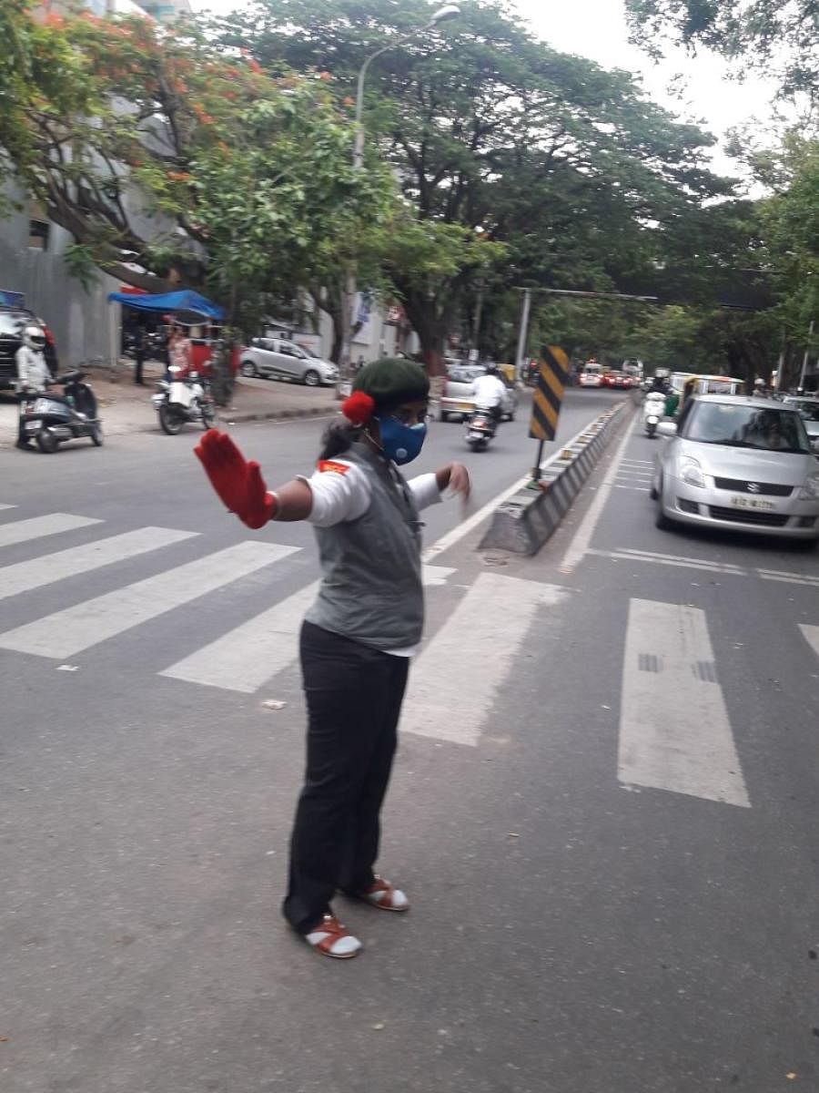 Geetha Lakshmi managing traffic on 13th main road junction in Indiranagar on Friday.
