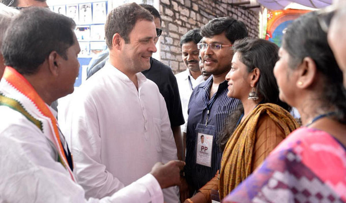 Congress president Rahul Gandhi interacts with relatives of former chief minister of Andhra Pradesh Damodaram Sanjivayya on Tuesday. DH photo