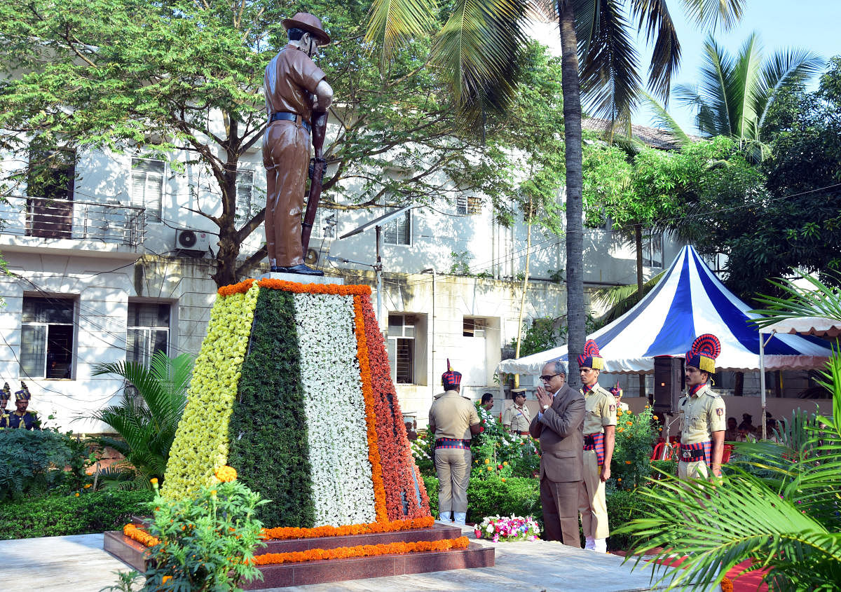 Principal District and Sessions Judge Kadluru Satyanarayanacharya pays floral tribute to police martyrs on the occasion of Police Martyrs’ Day at the memorial on the district police grounds in Mangaluru on Sunday.