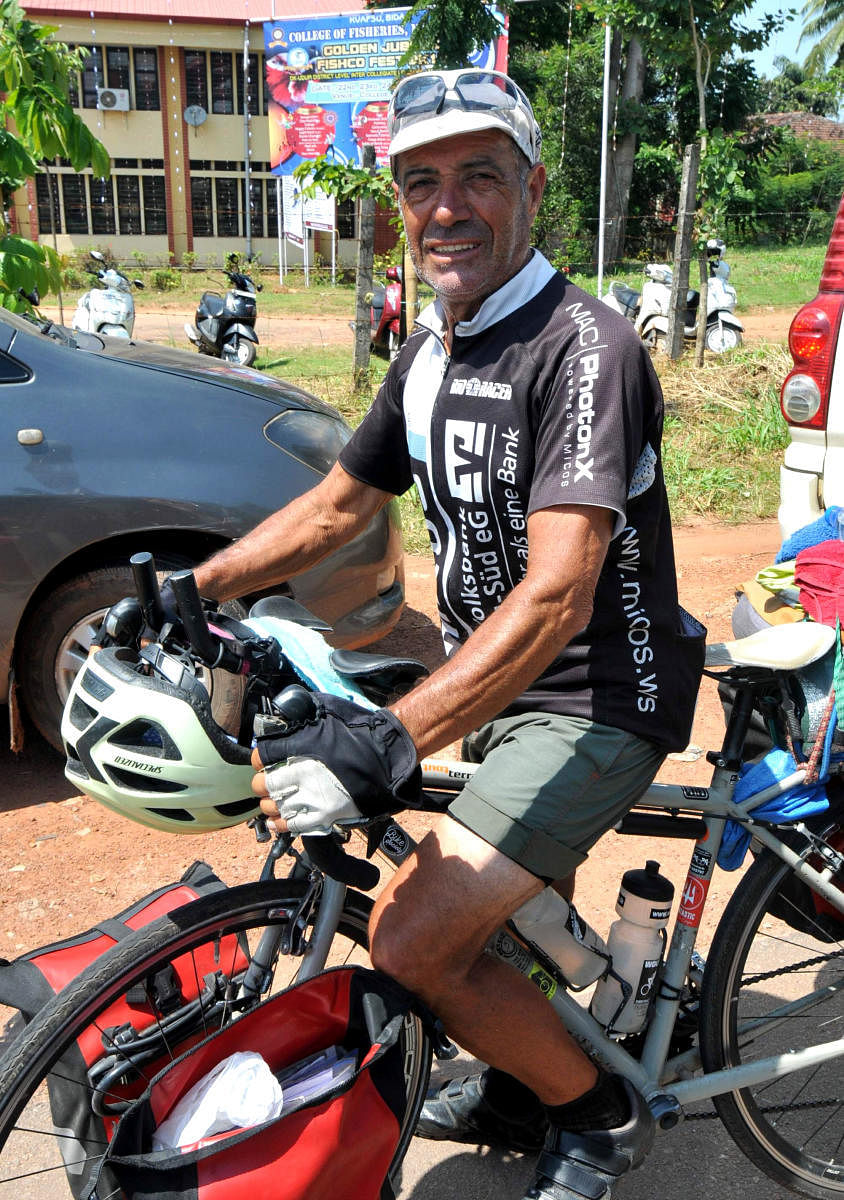 Globetrotting cyclist Armando Basile with his bicycle.