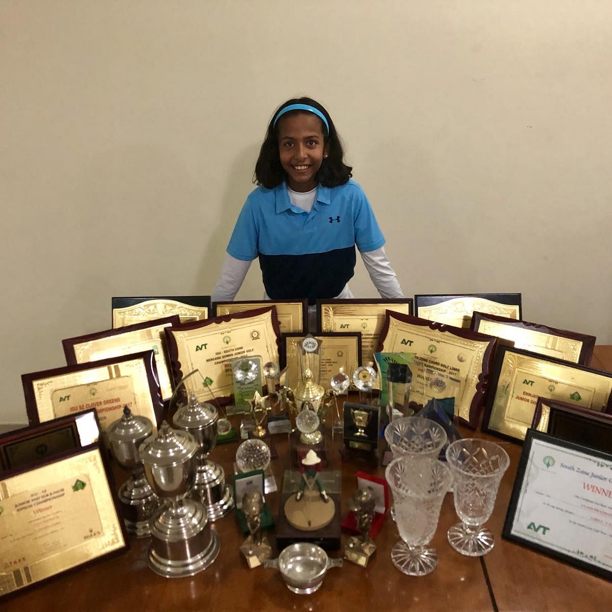 Golfer Avani Prashanth with the collection of trophies she has won over the years. 