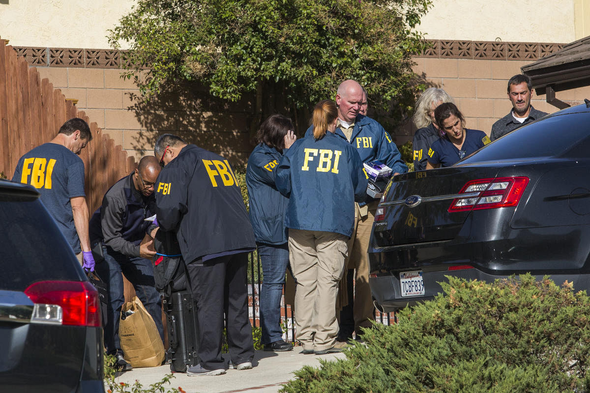 FBI agents collect evidence at the home of suspected nightclub shooter Ian David Long, in Thousand Oaks in California. AFP photo