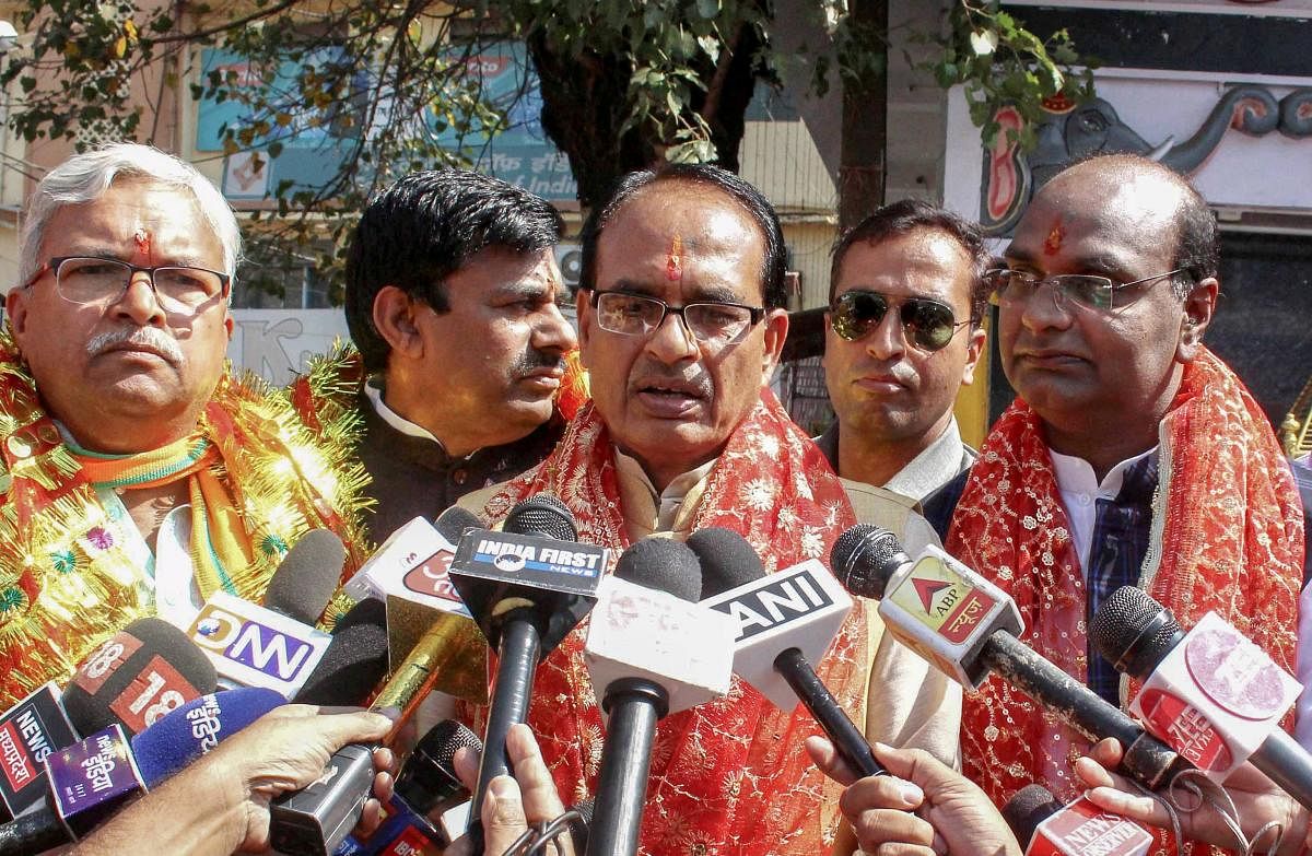 Madhya Pradesh Chief Minister Shivraj Singh Chouhan speaks to the reporters after offering prayers along with Bhopal BJP candidates before filing their nomination papers and launch of the election campaign for state Assembly elections, in Bhopal, on Frida