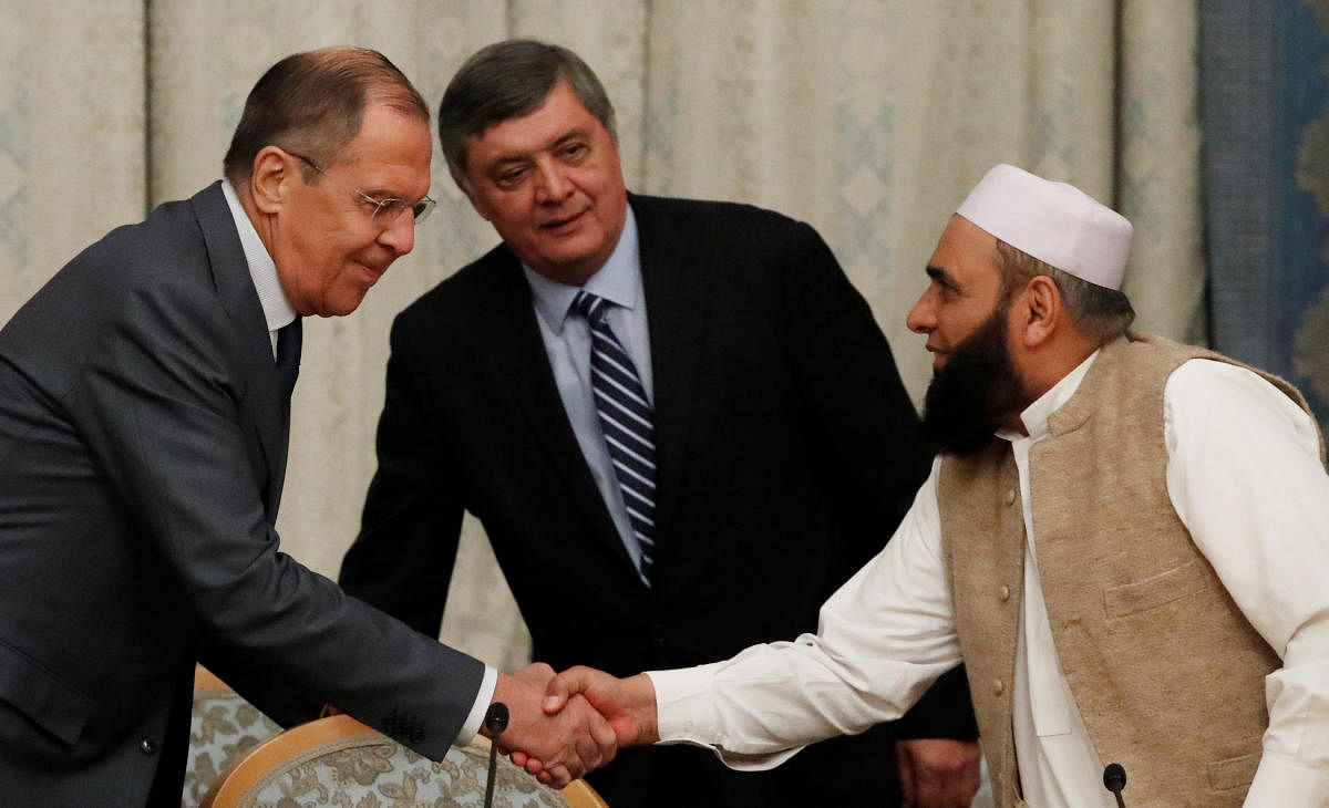 Russian Foreign Minister Sergei Lavrov welcomes member of Taliban delegation Alhaj Mohammad Sohail Shaina during the multilateral peace talks on Afghanistan in Moscow, Russia on November 9, 2018. Reuters