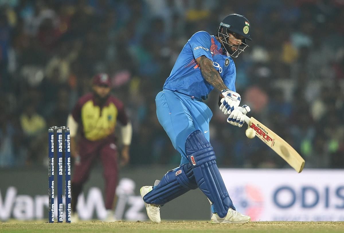 Indian cricketer Shikhar Dhawan plays a shot during the 3rd and final T20 match against West Indies in Chennai, Sunday, Nov. 11, 2018. (PTI Photo)