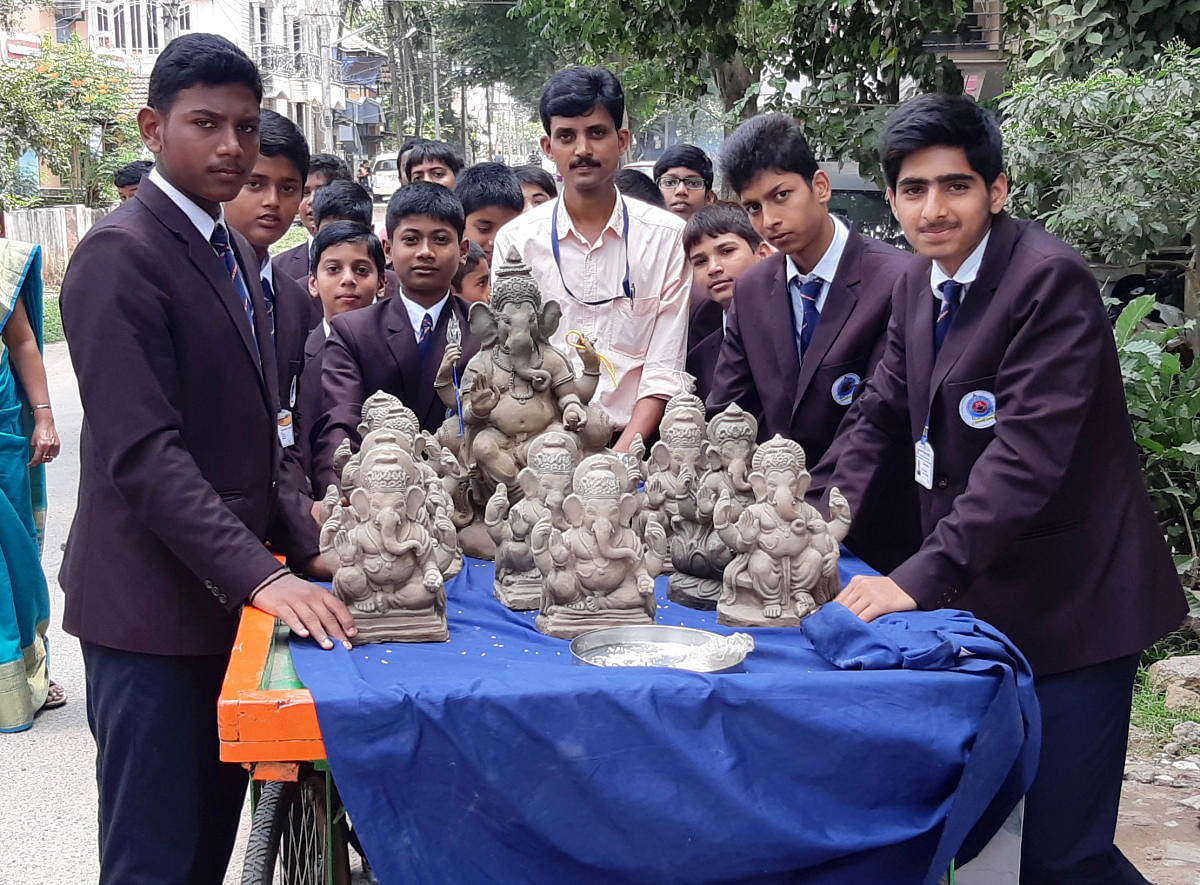 eco-friendly efforts: Students of Vasavi Public School in Shivamogga with clay Ganesha idols.
