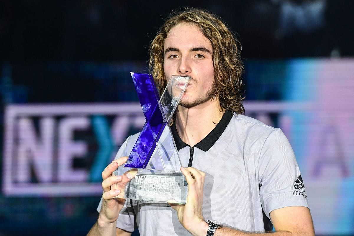 Greece's Stefanos Tsitsipas kisses the trophy after winning the men's final on Saturday. AFP