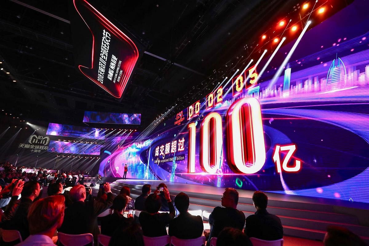 A screen shows the gross merchandise volume, a measure of sales, after 2 seconds of Singles Day sales, as it reaches about 1,437,752,505 USD during the 2018 Tmall 11:11 Global Shopping Festival gala in Shanghai. AFP photo