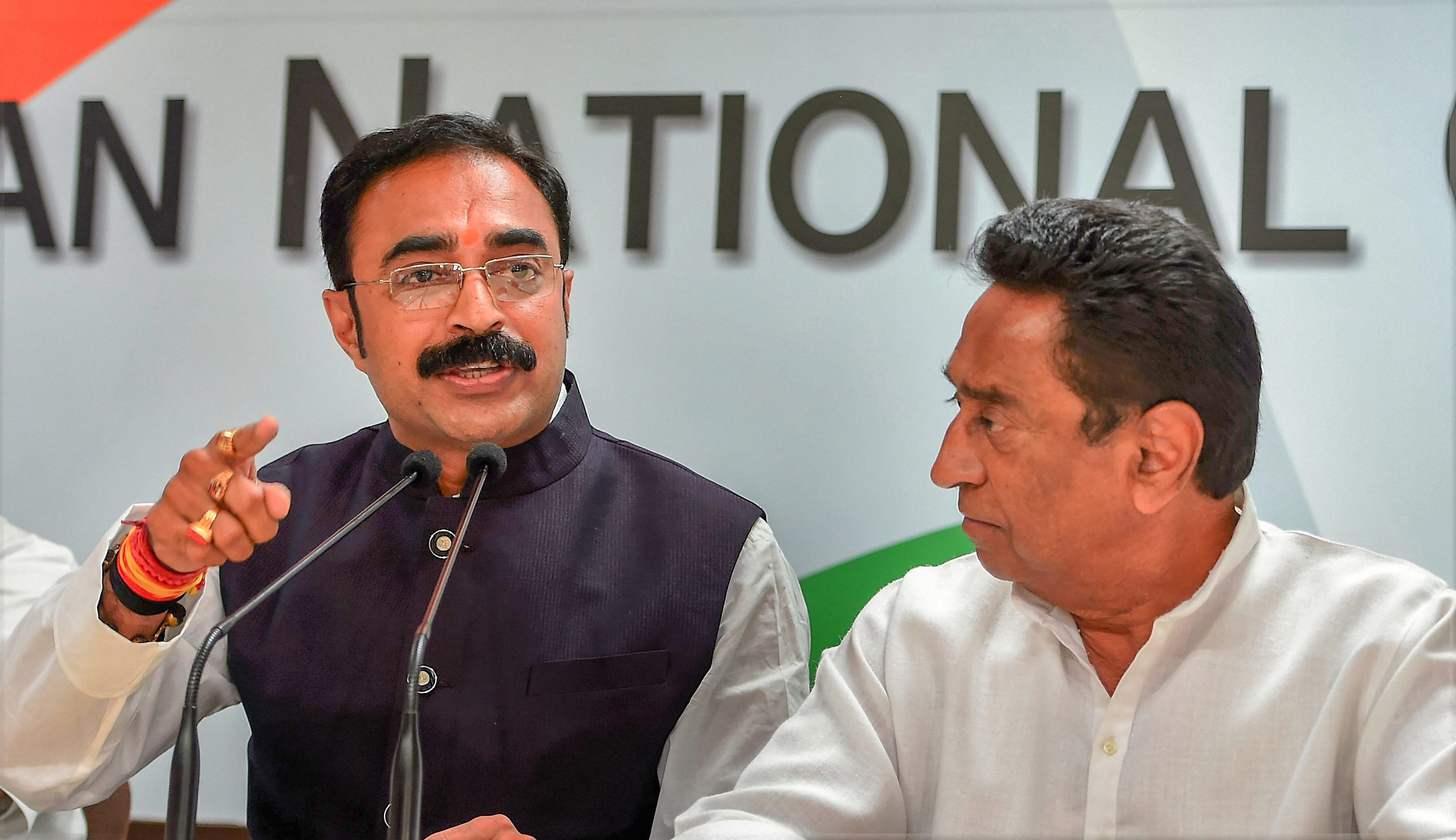 Sanjay Singh, brother-in-law of Madhya Pradesh Chief Minister Shivraj Singh Chouhan addresses the press along with senior Congress leaders Kamal nath after joining the Congress party, at AICC in New Delhi on Saturday. PTI