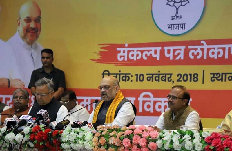 BJP National president Amit Shah along with Chhattisgarh Chief Minister Dr Raman Singh addressing the media before launch of election manifesto in a private hotel on Saturday