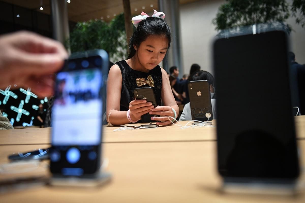 Apple warned earlier this month that holiday sales would miss Wall Street expectations due to weakness in emerging markets including India and foreign-exchange costs. (AFP photo)