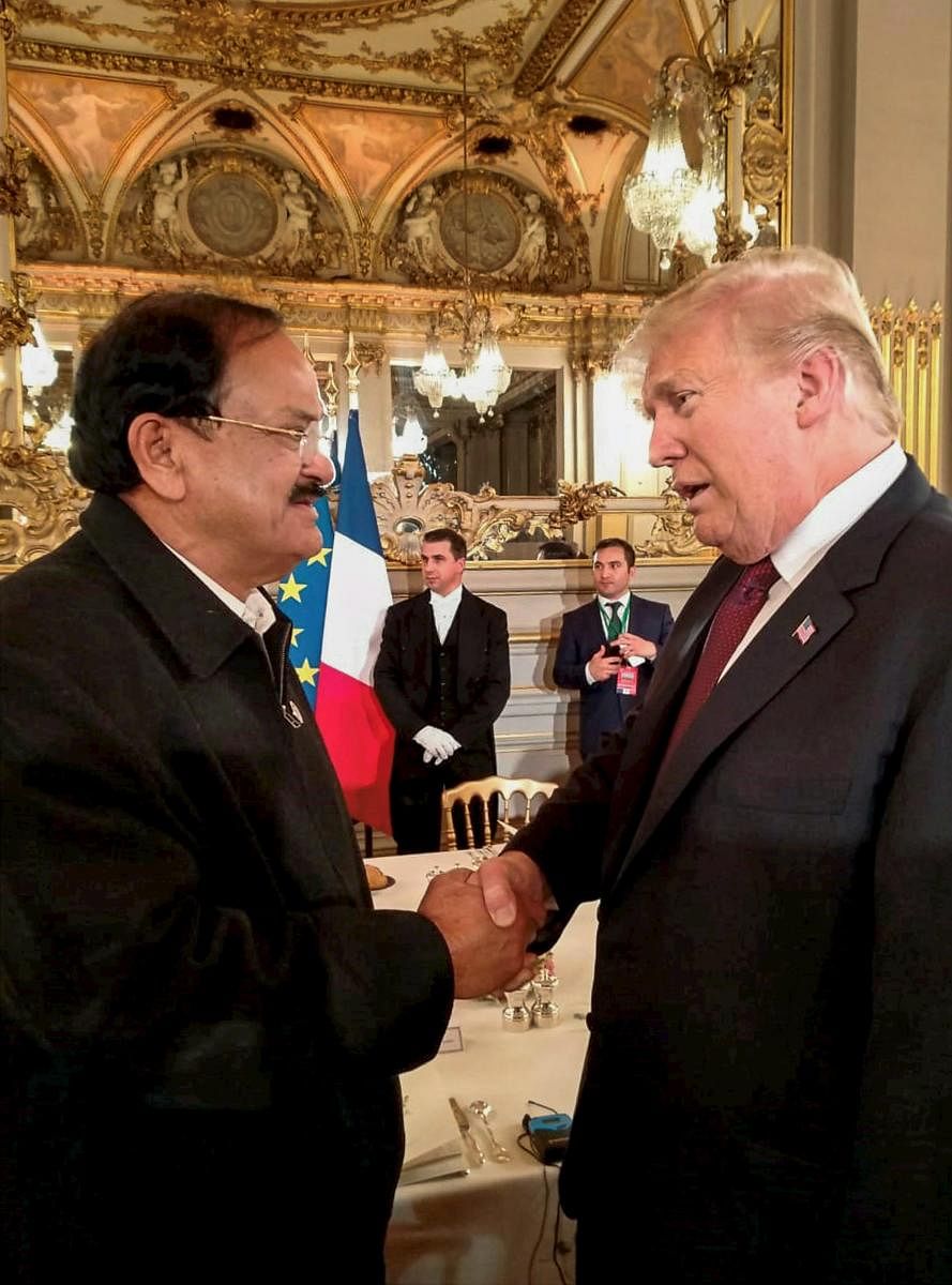 Vice President M Venkaiah Naidu meets president of the United States of America Donald Trump, at a banquet hosted by the French president, in Paris, France, on Saturday. PTI