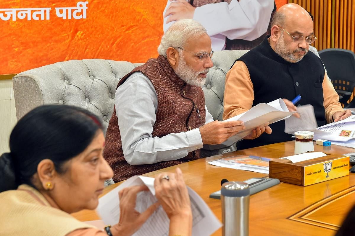 Prime Minister Narendra Modi, BJP president Amit Shah and External Affairs Minister Sushma Swaraj during the party's Central Election Committee meeting for the forthcoming Assembly polls in Rajasthan at party headquarters in New Delhi on Sunday. PTI