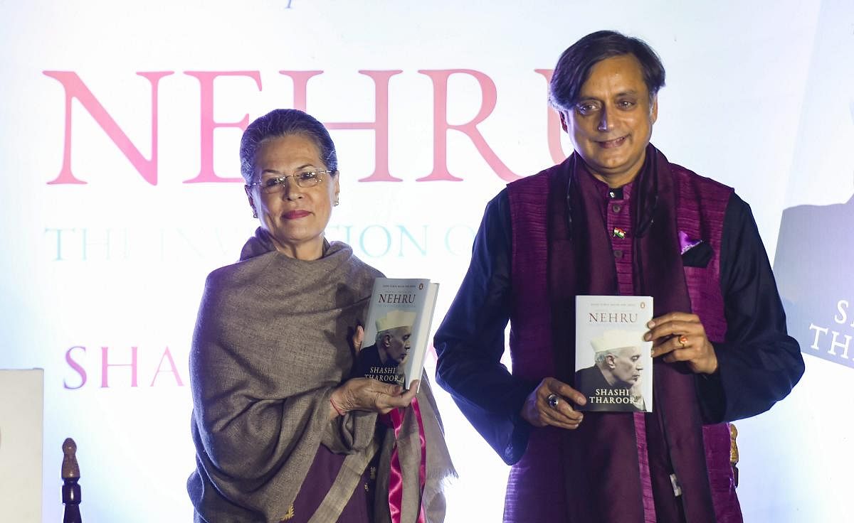 Former Congress President Sonia Gandhi with Congress MP Shashi Tharoor during latter's book 'Nehru: The Invention of India' launch event, in New Delhi, Tuesday, Nov 13, 2018. (PTI Photo)