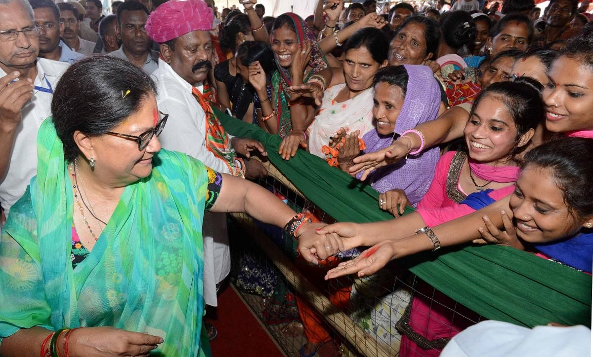 Rajasthan CM Vasundhara Raje meets people after a public meeting during 'Rajasthan Gaurav Yatra' at Kherwara, Rajasthan on Sunday. PTI photo