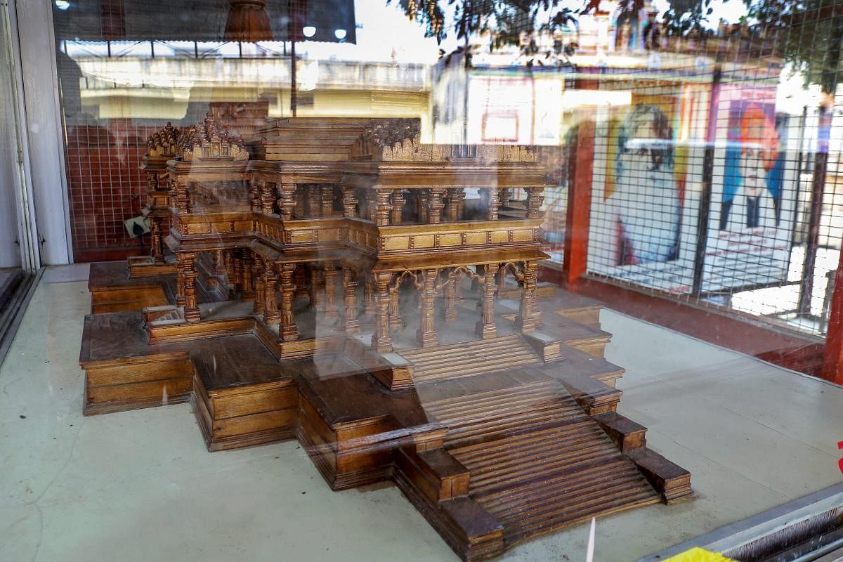 A wooden model of the 'proposed Ram temple' in a glass encasement, at the Ram Janmabhomi Nyas-run workshop at Karsevakpuram in Ayodhya, on Nov 12, 2018. PTI photo