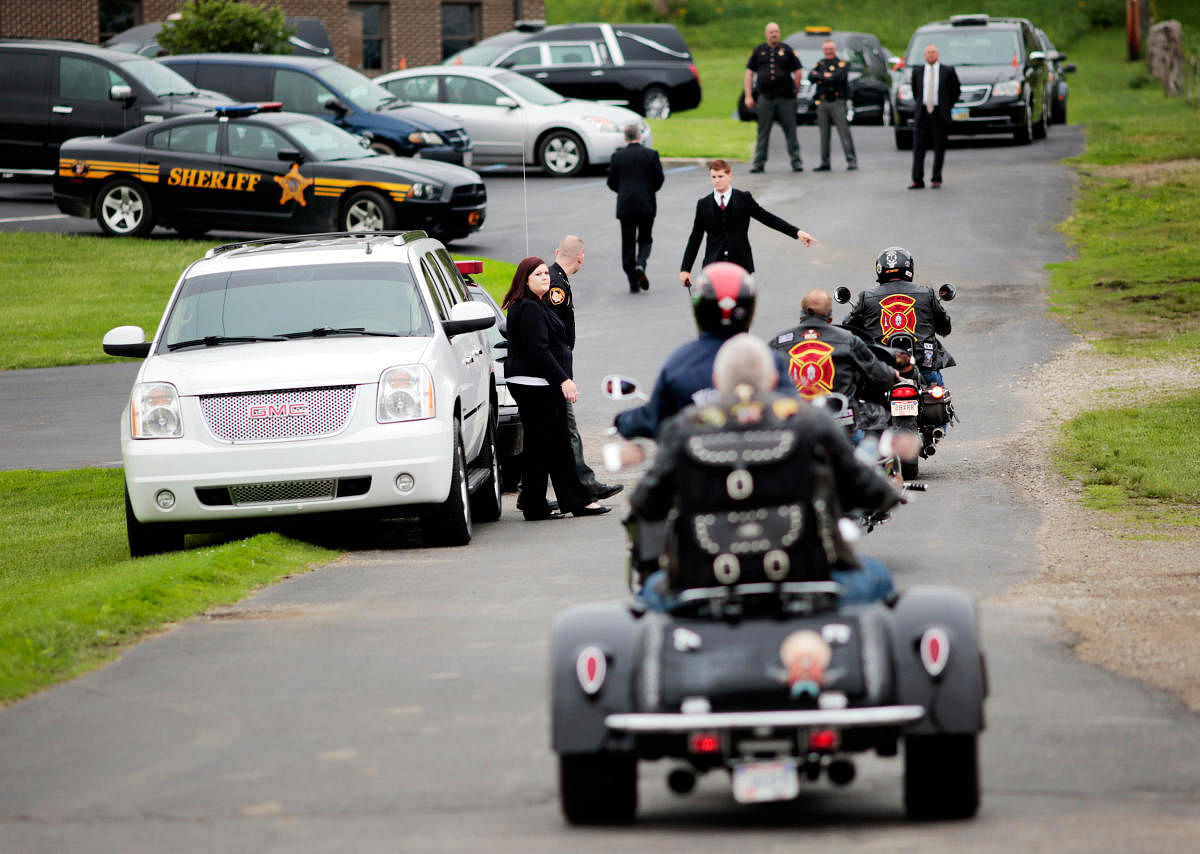File photo: Motorcyclists from Red Knights International Firefighter Club arrive to attend a funeral for six members of the Rhoden family in rural Ohio. (Reuters)